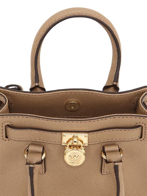 do michael kors purses have a warranty|Michael Kors complaint department.